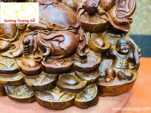 Di Lặc ngũ tiểu ngồi đống tiền gỗ cẩm.