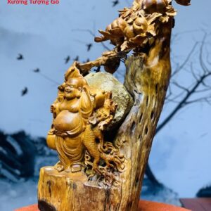 Di Lặc Gánh Gậy Đứng cây Đào