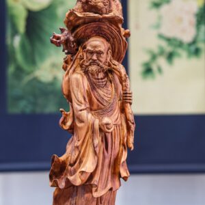 Đạt ma đứng lân gỗ sưa