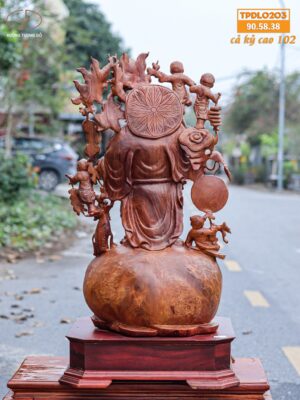Di Lạc Vác Cành Đào Ngũ Tiểu Đứng Bao Tiền Gỗ Nu Hương