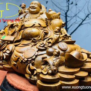 Di Lặc ngũ tiểu ngồi bao tiền.