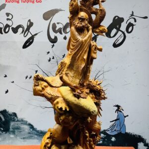 Đạt Ma đứng rồng ôm đá gỗ hương.