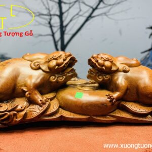 Nhị Nghê trấn chum tiền gỗ hương.