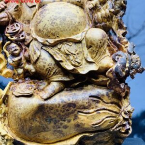 Di Lặc nhị tiểu vác đào nu hương.