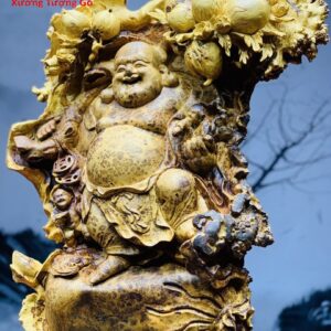 Di Lặc nhị tiểu vác đào nu hương.