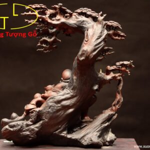 Di Lặc ngồi voi gỗ trắc.