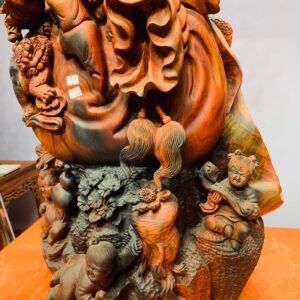 Di Lặc cửu tiểu vác đào đứng tùng gỗ trắc