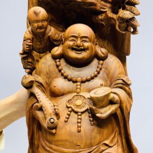 Di lặc cầm gậy như ý đứng tùng gỗ sưa