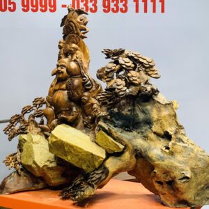 Di Lặc tam tiểu đứng tùng ôm đá
