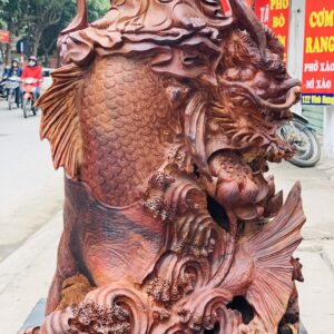 Quan Âm ngự cá chép hóa rồng gỗ cẩm.