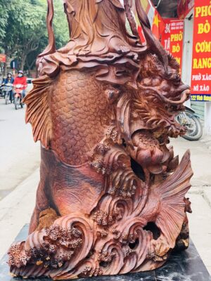 Quan Âm ngự cá chép hóa rồng gỗ cẩm.