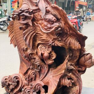 Quan Âm ngự cá chép hóa rồng gỗ cẩm.