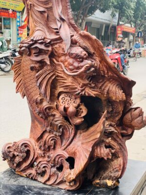 Quan Âm ngự cá chép hóa rồng gỗ cẩm.