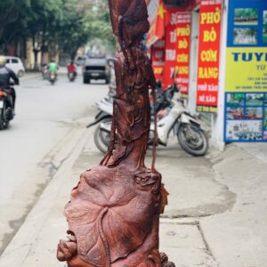Quan Âm ngự cá chép hóa rồng gỗ cẩm.