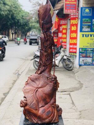 Quan Âm ngự cá chép hóa rồng gỗ cẩm.