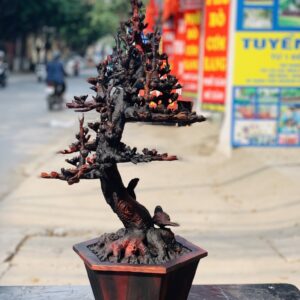 Bình hoa mai gỗ trắc.