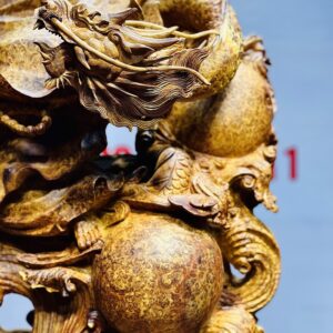 Đạt Ma múa võ song long gỗ nu hương.