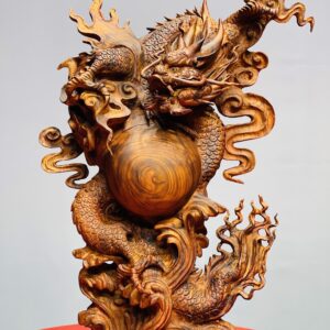 Rồng trấn ngọc gỗ sưa.