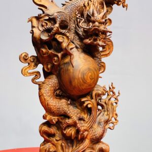 Rồng trấn ngọc gỗ sưa.