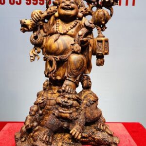 Tượng Di Lạc vác cành đào đứng Nghê Gỗ Sưa
