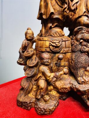 Tượng Di Lạc vác cành đào đứng Nghê Gỗ Sưa