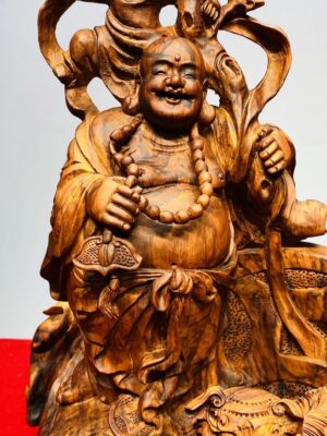 Tượng Di Lạc Nhị Tiểu vác cành đào đứng Nghê Gỗ Sưa