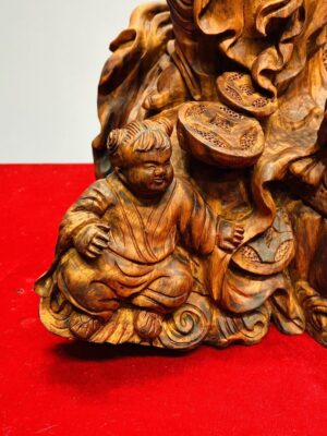 Tượng Di Lạc Nhị Tiểu vác cành đào đứng Nghê Gỗ Sưa