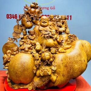 Di Lạc Cửu Tiểu vác cành đào ngồi bao tiền Gỗ Nu Hương
