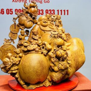 Di Lạc Cửu Tiểu vác cành đào ngồi bao tiền Gỗ Nu Hương