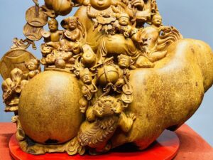 Di Lạc Cửu Tiểu vác cành đào ngồi bao tiền Gỗ Nu Hương