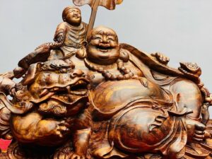 Di Lạc Ngũ Phúc Vác Gậy Như Ý Bên Nghê Gỗ Sưa