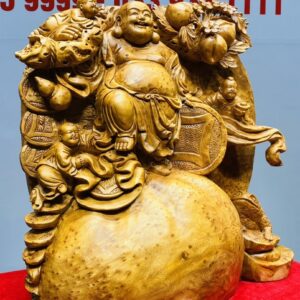 Di Lạc Tam Tiểu Vác Cành Đào Đứng Bao Tiền Gỗ Nu Ngọc Am