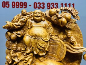 Di Lạc Tam Tiểu Vác Cành Đào Đứng Bao Tiền Gỗ Nu Ngọc Am