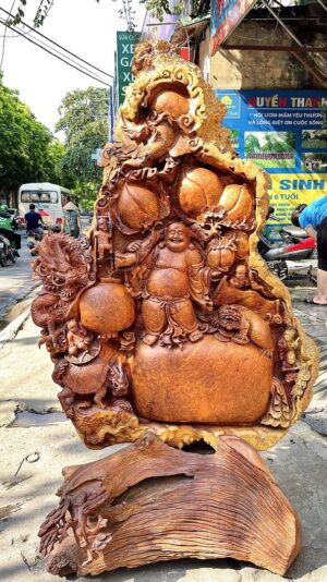 Di Lạc Ngũ Phúc Tứ Linh Vác Cành Đào Đứng Bao Tiền Gỗ Nu Hương