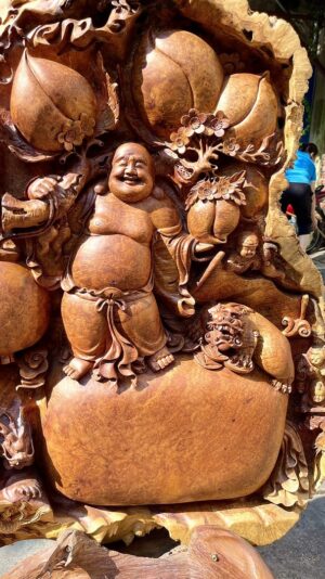 Di Lạc Ngũ Phúc Tứ Linh Vác Cành Đào Đứng Bao Tiền Gỗ Nu Hương