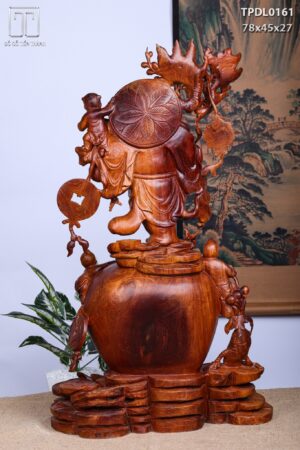 Di Lặc Vác Cành Đào Tam Tiểu Đứng Chum Tiền Gỗ Nu Hương