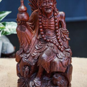 Tế công cầm bình rượu tử đàn